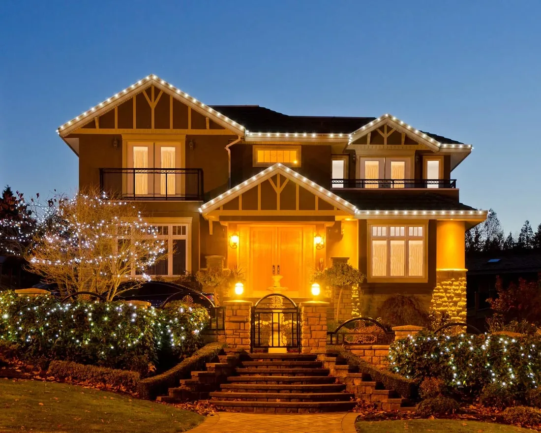 Home with professionally installed C9 LED Christmas lights at dusk in the Evansville, IN metro